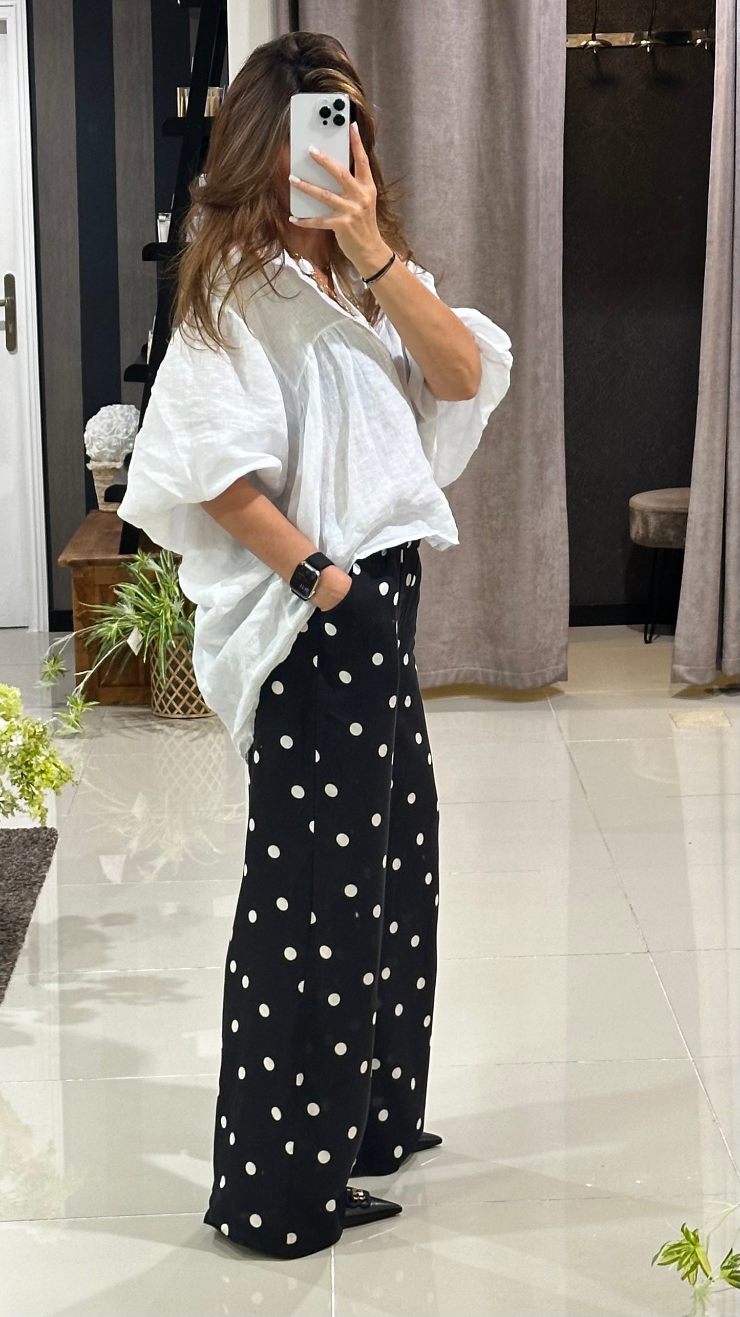 Pantalon noir à pois blanc