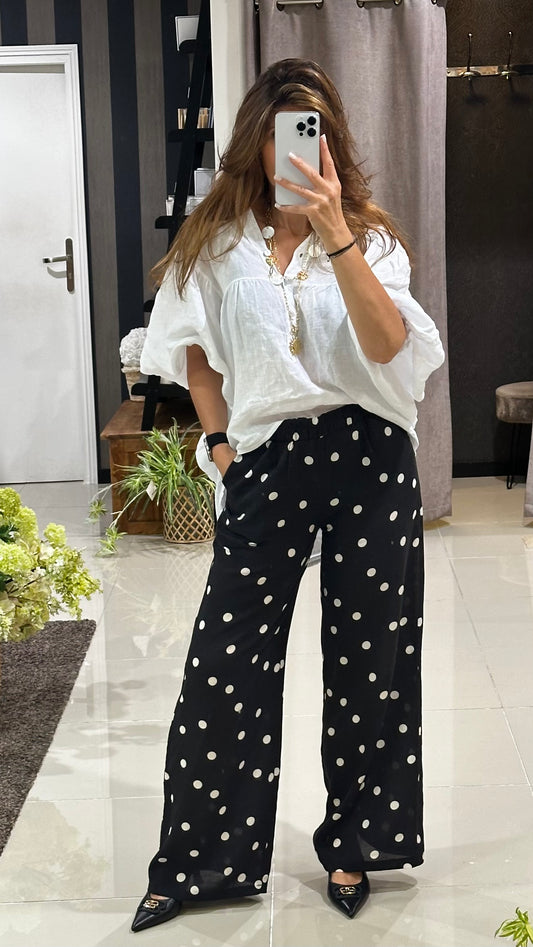 Pantalon noir à pois blanc